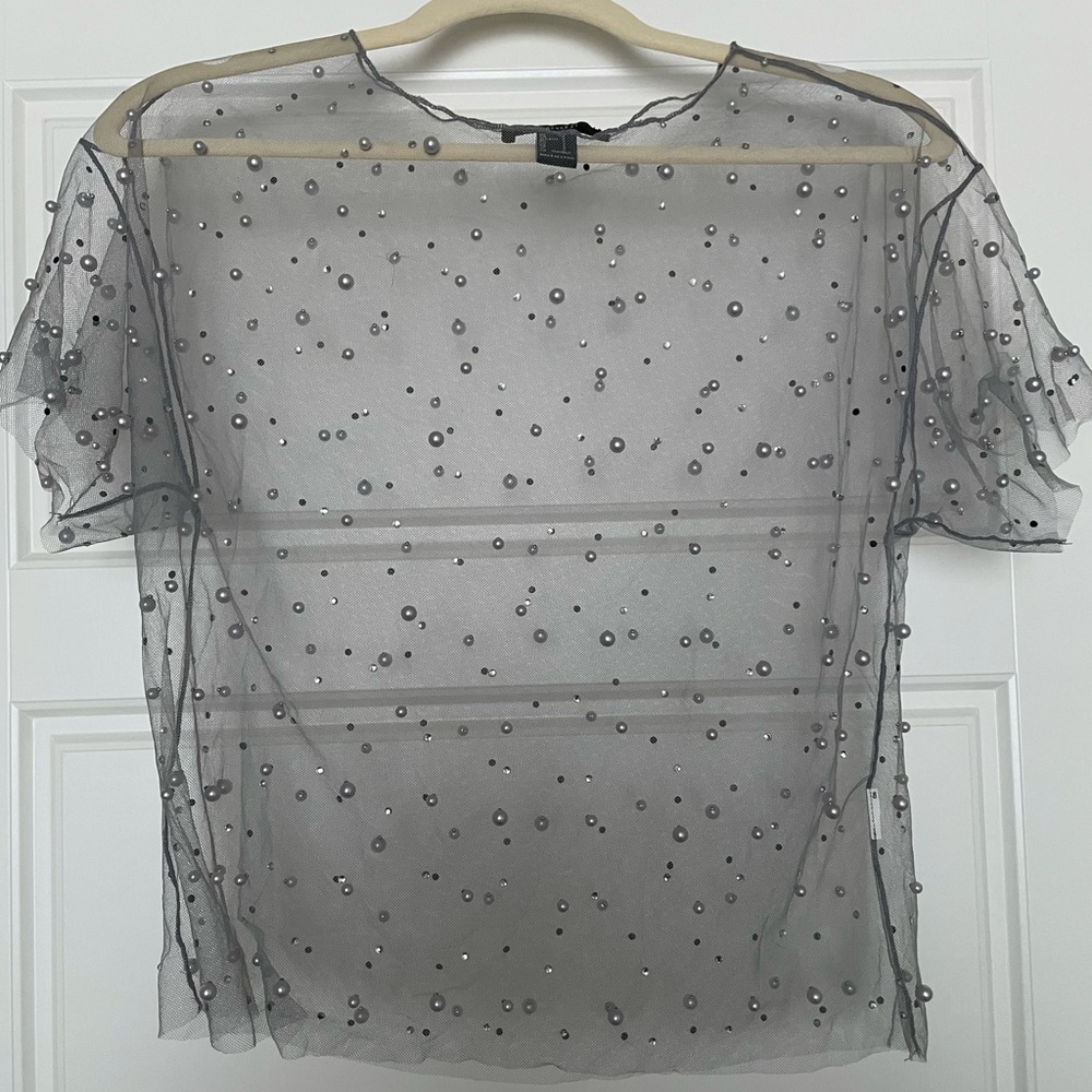 Sheer top with accent beading
